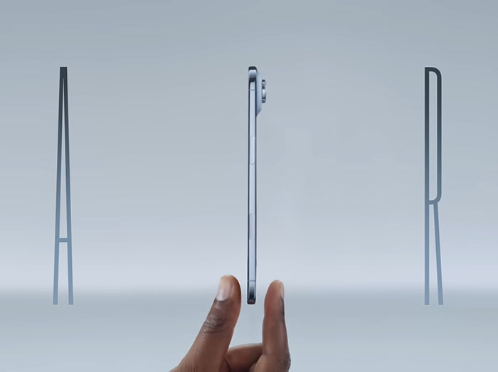 Hand holding a thin smartphone in profile view, symbolizing Samsung brutally mocking new iPhone design. Hand holding a thin smartphone in profile view, symbolizing Samsung brutally mocking new iPhone design.