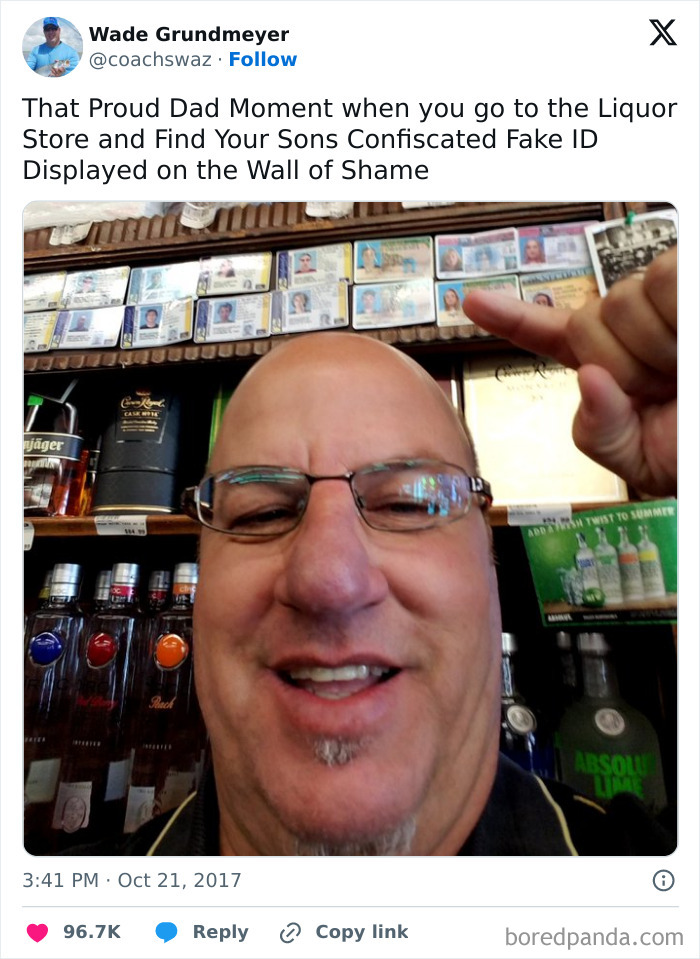 Man smiling and pointing to confiscated fake IDs displayed on a liquor store wall among funniest parents ever photos.