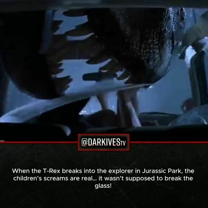 Close-up of a T-Rex breaking glass, illustrating terrifying facts and dark stories from our strange world.