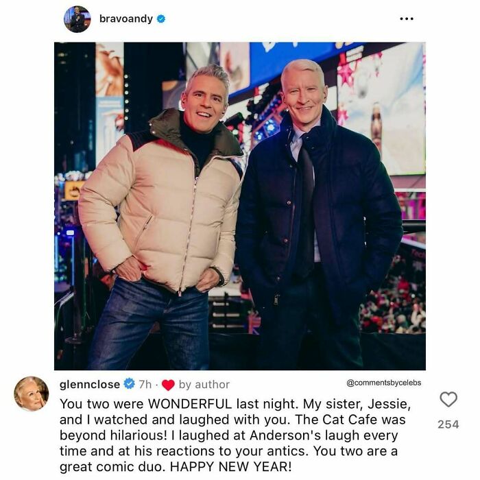 Two men in warm jackets smiling in a lively urban setting, showcasing unexpected gems from celeb comments.