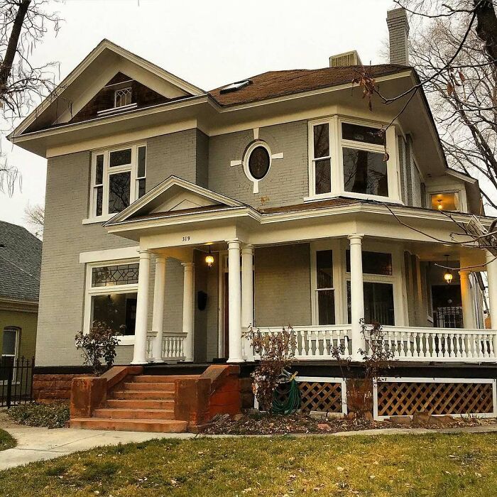 Charming old home with spacious porch, classic columns, and vintage architectural details in a quiet neighborhood setting.