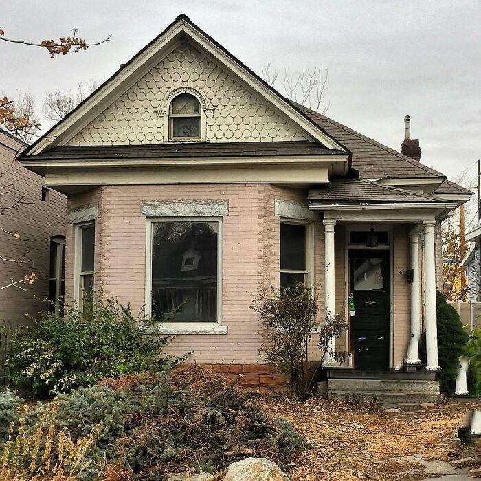 Adorable old home with classic architecture, charming details, and mature landscaping in a quiet neighborhood setting.