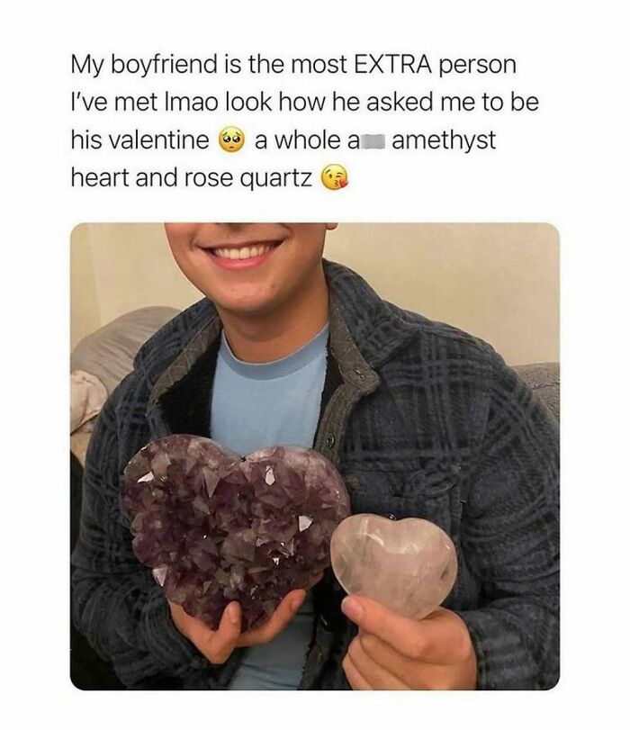 Smiling person holding a heart-shaped amethyst and rose quartz, a wholesome relationship meme beyond relatable.