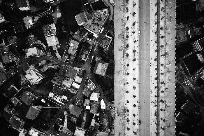 Aerial view of a city street and buildings in an award-winning black-and-white photo from Exposure One Awards.