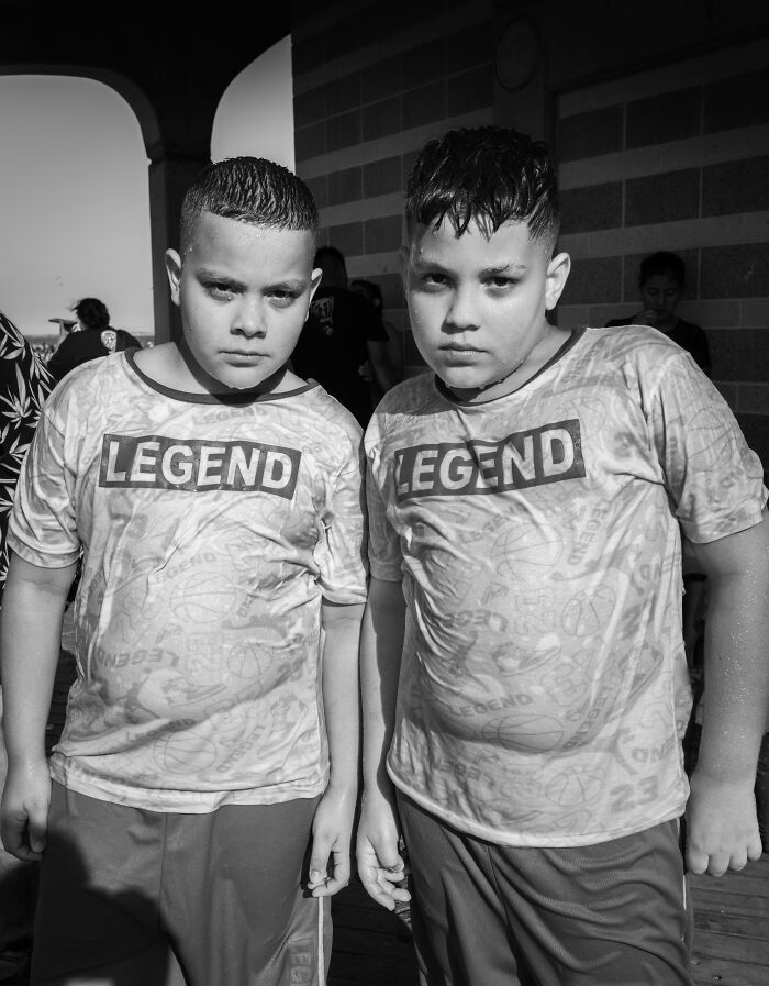 Black-and-white photo of two boys wearing Legend shirts, captured as part of award-winning black-and-white photos Exposure One Awards.