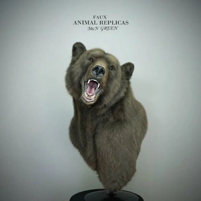 Realistic animal sculpture of a roaring bear crafted from synthetic materials without harming wildlife.