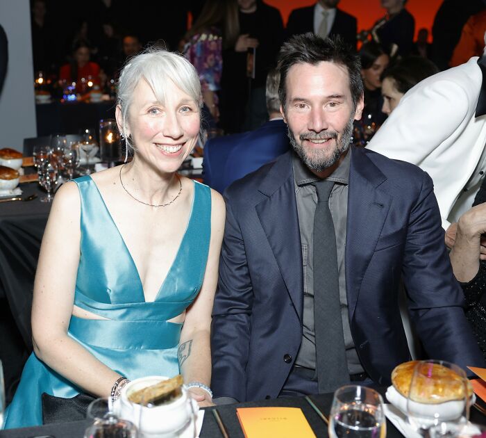 Keanu Reeves and his girlfriend smiling at a formal event as she breaks her silence on marriage rumors. Keanu Reeves and his girlfriend smiling at a formal event as she breaks her silence on marriage rumors.