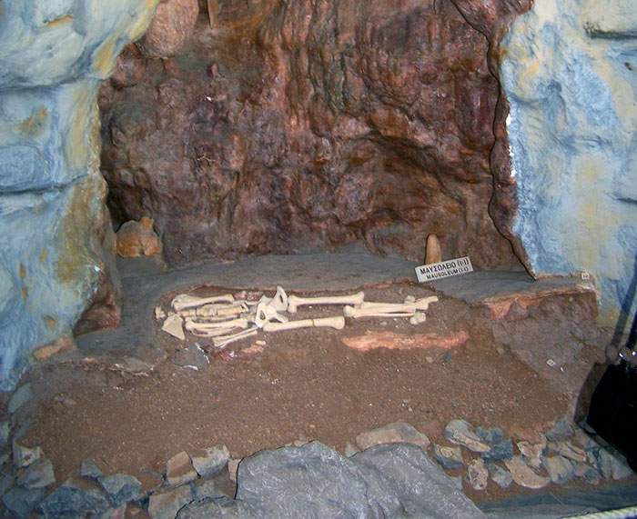 Skeleton remains displayed inside a cave representing the mysterious Petralona Man skull found by experts. Skeleton remains displayed inside a cave representing the mysterious Petralona Man skull found by experts.