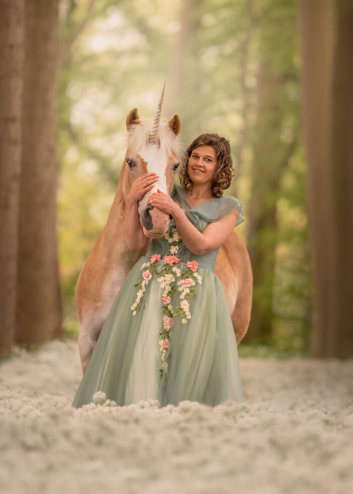 Young girl hugging a white unicorn pet in a field, a creative pet photo with heartwarming tones winning photography awards.