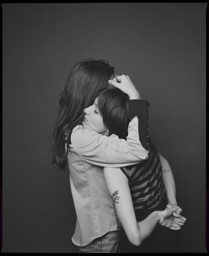 Two people embracing in a black and white analog photo featured in the 2025 Analog Sparks Awards.