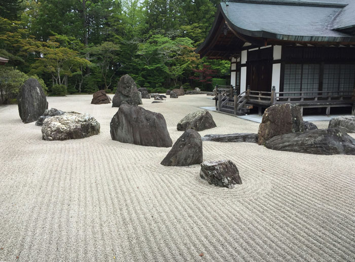 Zen rock garden at a park with no-walking area, illustrating a peaceful setting before toddler causes drama with a stranger and mom. Zen rock garden at a park with no-walking area, illustrating a peaceful setting before toddler causes drama with a stranger and mom.