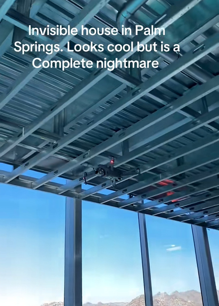 Invisible house interior in Palm Springs with metal beams and large windows, related to Airbnb owners charging influencer. Invisible house interior in Palm Springs with metal beams and large windows, related to Airbnb owners charging influencer.