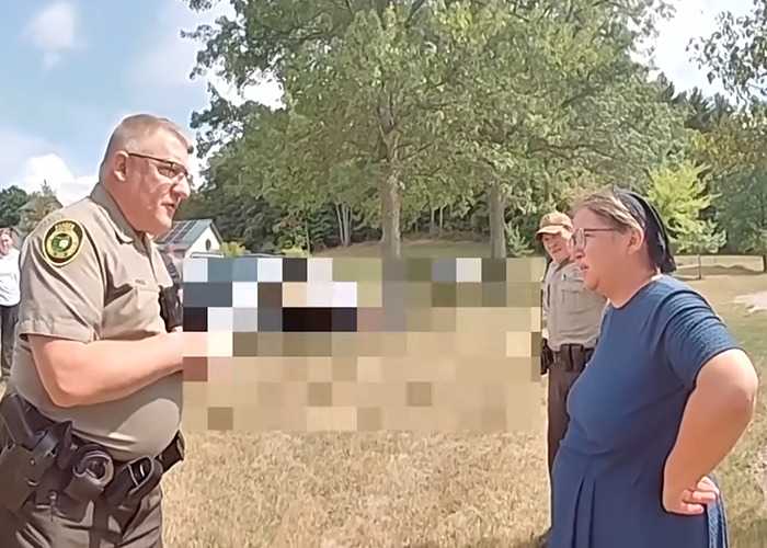 Amish mom speaking with officers outdoors, related to chilling confession after drowning 4-year-old son, viral incident. Amish mom speaking with officers outdoors, related to chilling confession after drowning 4-year-old son, viral incident.