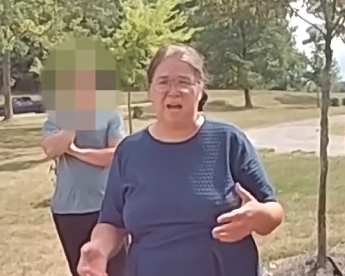 Amish mom in blue shirt making a chilling confession to officers outdoors after drowning 4-year-old son incident goes viral. Amish mom in blue shirt making a chilling confession to officers outdoors after drowning 4-year-old son incident goes viral.