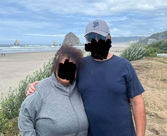 Couple posing on beach with ocean and rock formations in background, representing breaking up over photograph. Couple posing on beach with ocean and rock formations in background, representing breaking up over photograph.