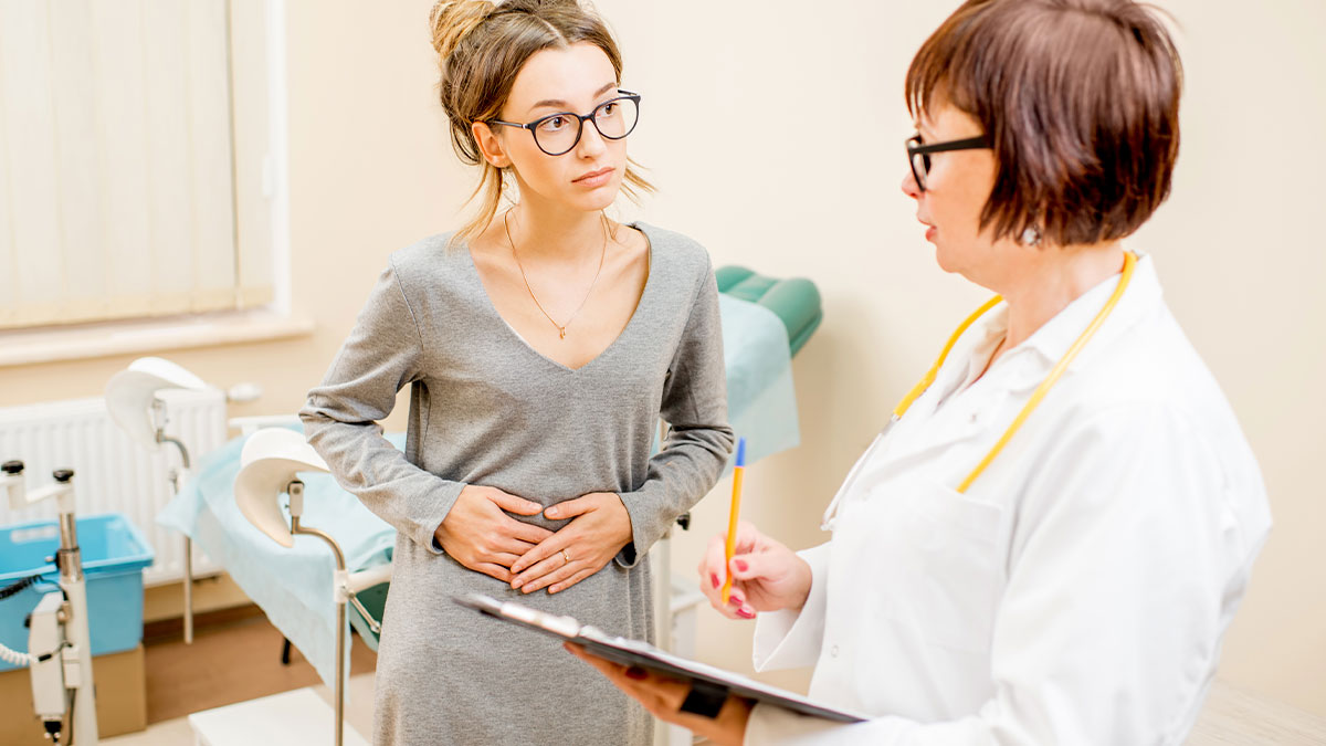 Young woman with chronic illness discussing symptoms with doctor in medical office offering unusual cures.
