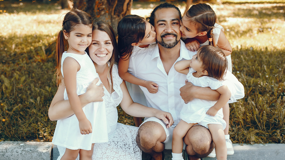 Happy family with mom, dad, and children outdoors, highlighting abandoned son and no boys necessary concept.
