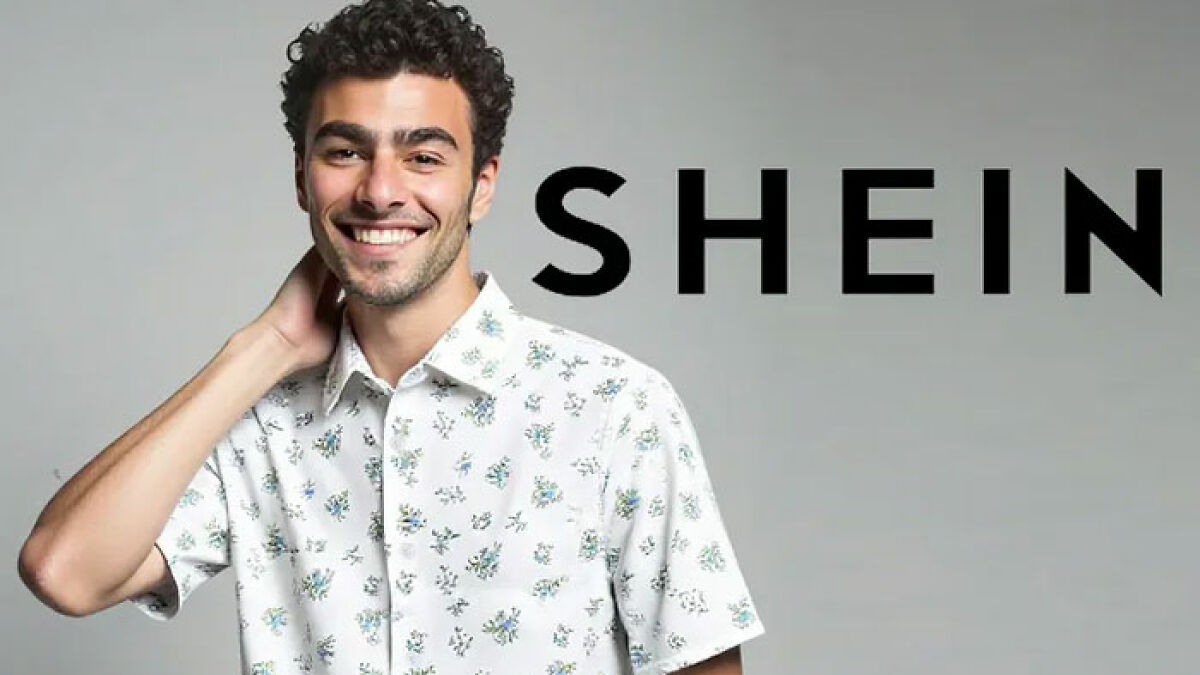 Model Luigi Mangione smiling and posing in a floral shirt for a viral Shein ad related to Americas Next Top Model.