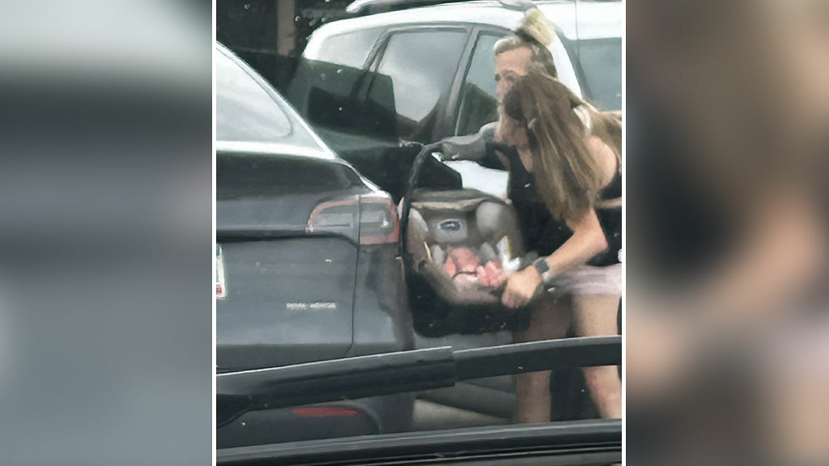 Conjoined twins Abby and Brittany seen together holding a baby in a car, expert discusses who would be the mom.