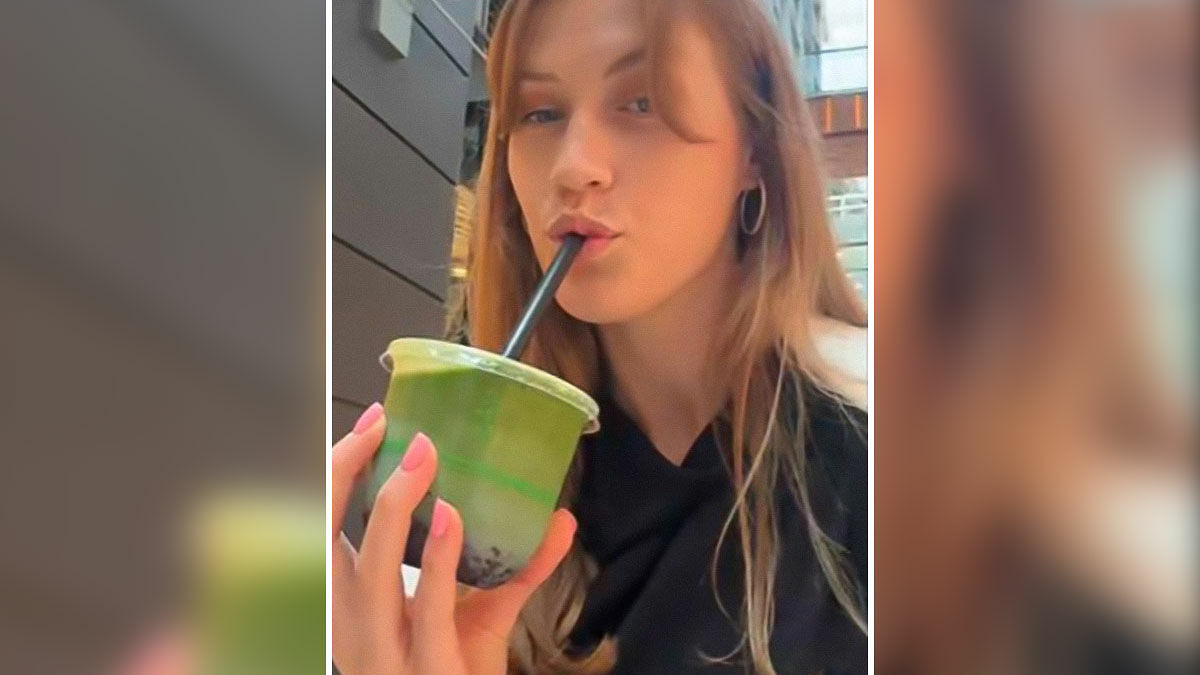 Young woman drinking green matcha tea through a straw while issuing a public warning about matcha health risks.