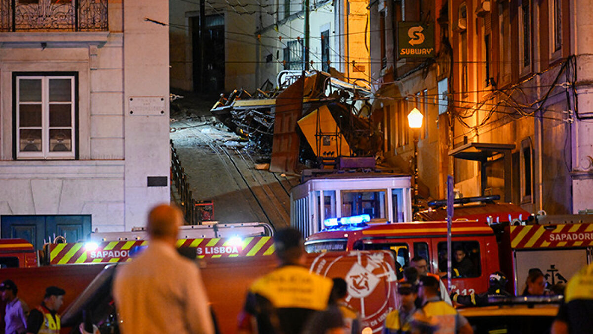 Emergency responders at night near wreckage of Lisbon crash where dad feared lost is found alive after toddler son rescue.