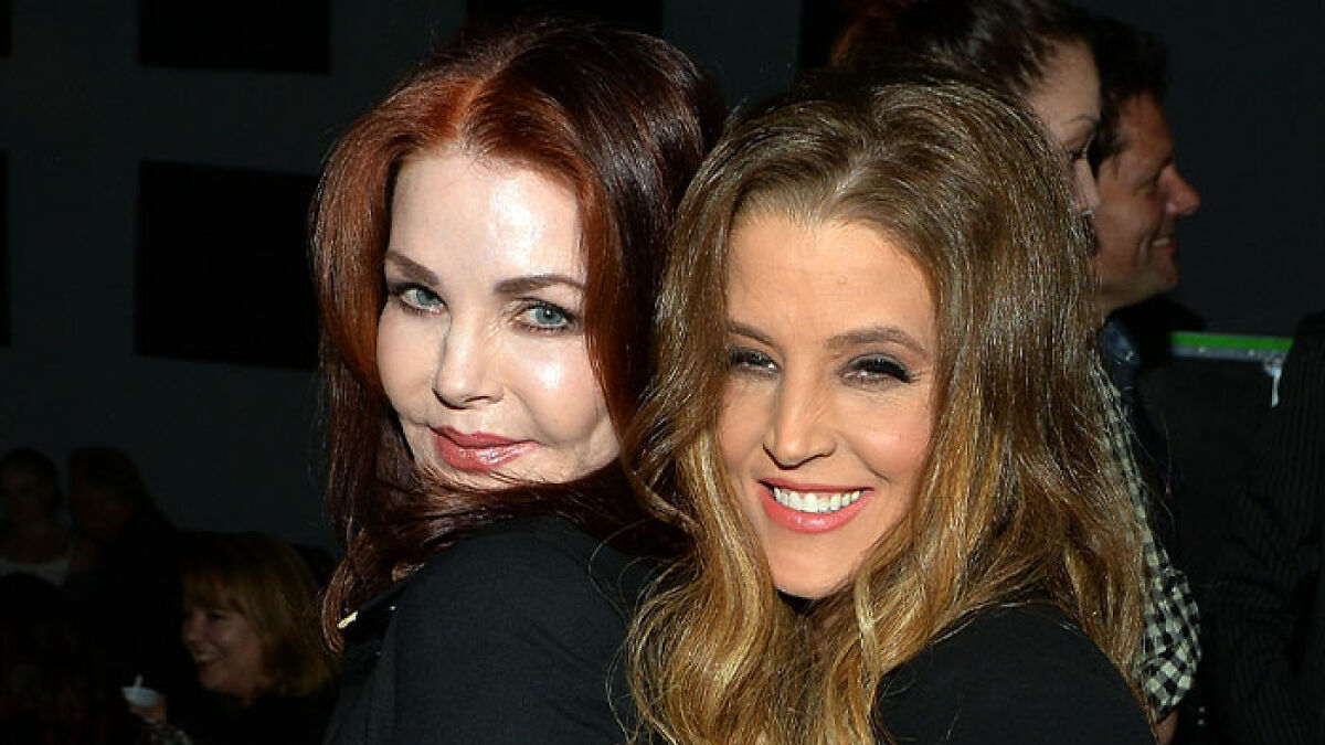 Priscilla and Lisa Marie Presley smiling together at an event, highlighting lawsuit and heartbreaking final moments topics.