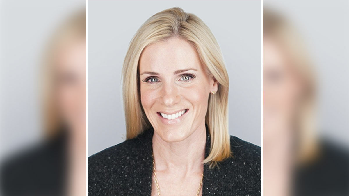 Kristin Cabot smiling in a professional headshot, former HR chief and ex-astronomer involved in Coldplay scandal.
