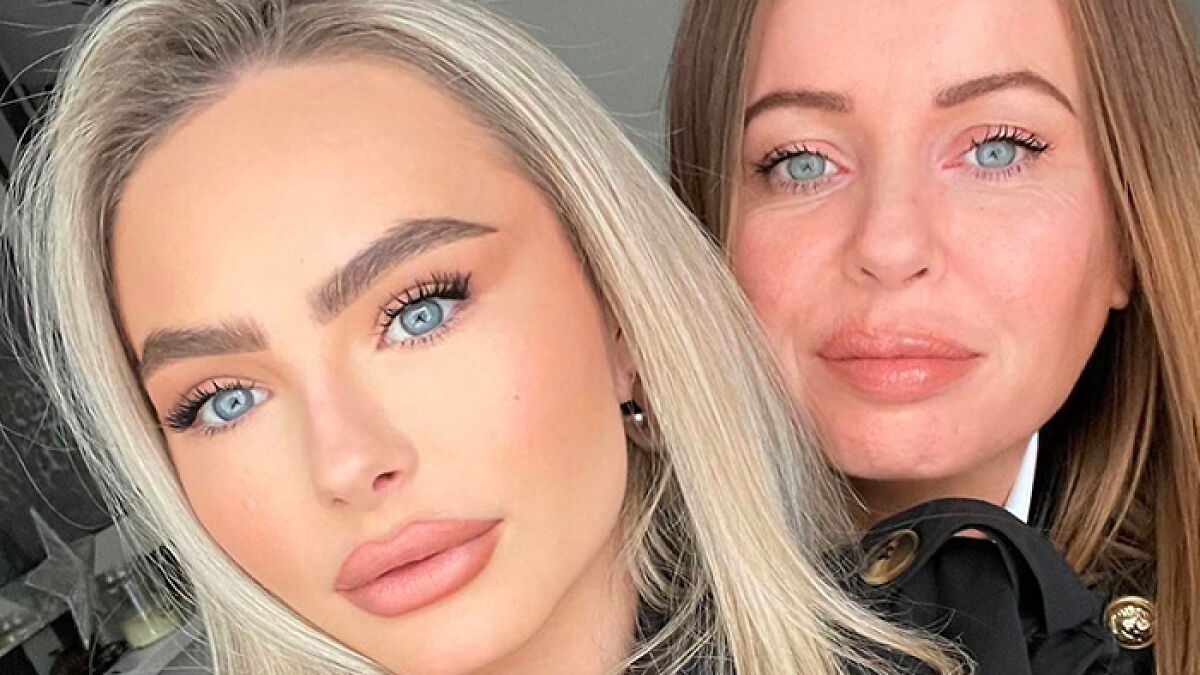 Two women with light hair and blue eyes posing closely, related to mom of student jailed for life in Dubai story.