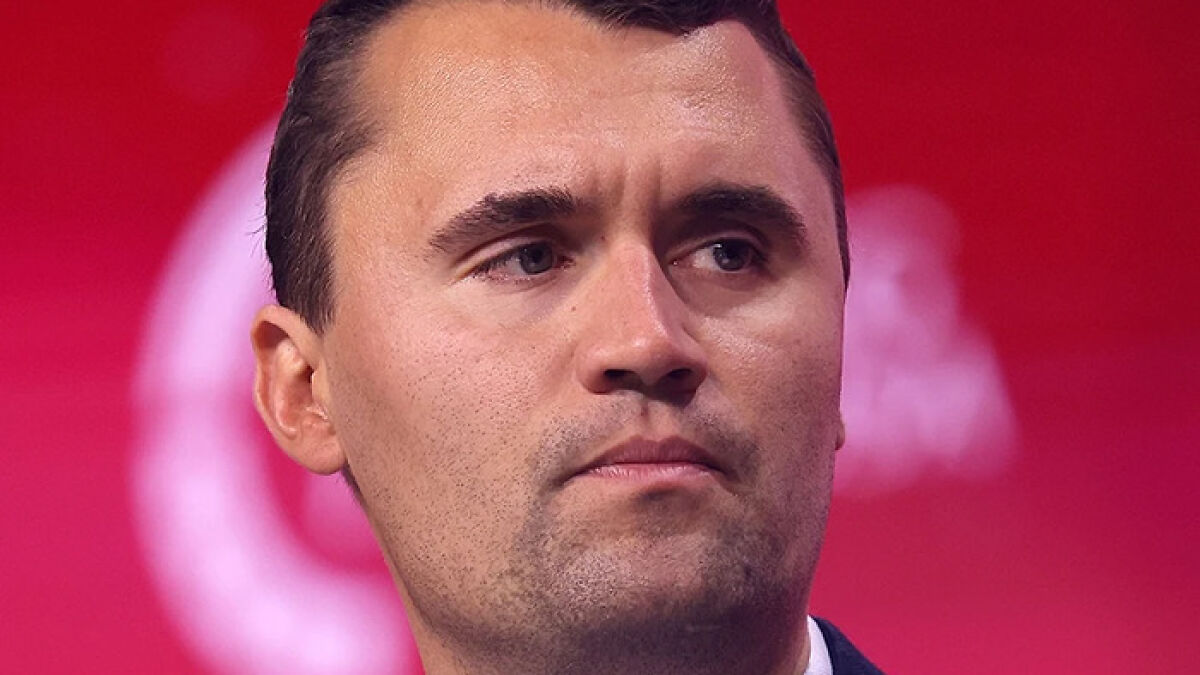 Close-up of commentator with serious expression related to unacceptable Charlie Kirk remarks after Utah tragedy.