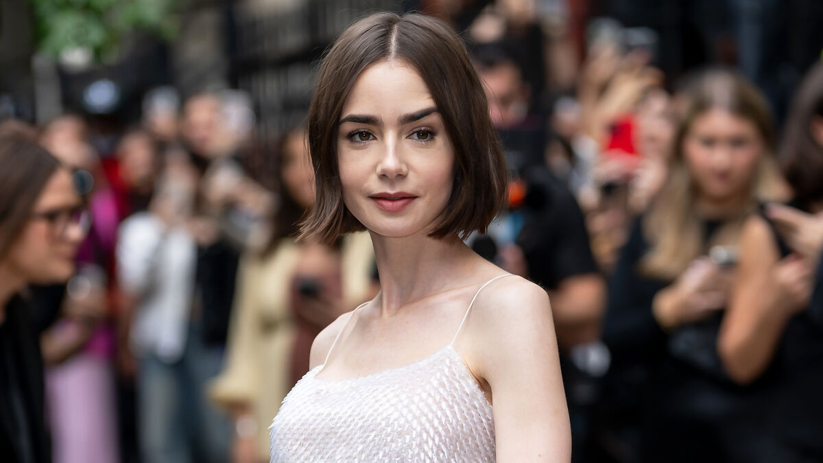 Lily Collins with a skinny appearance at a public event, sparking concern among fans about extreme thinness.
