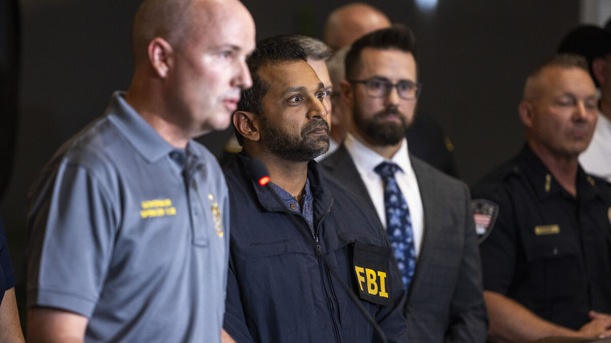 FBI director and officials at a press conference amid growing calls to quit after Charlie Kirk case controversy.