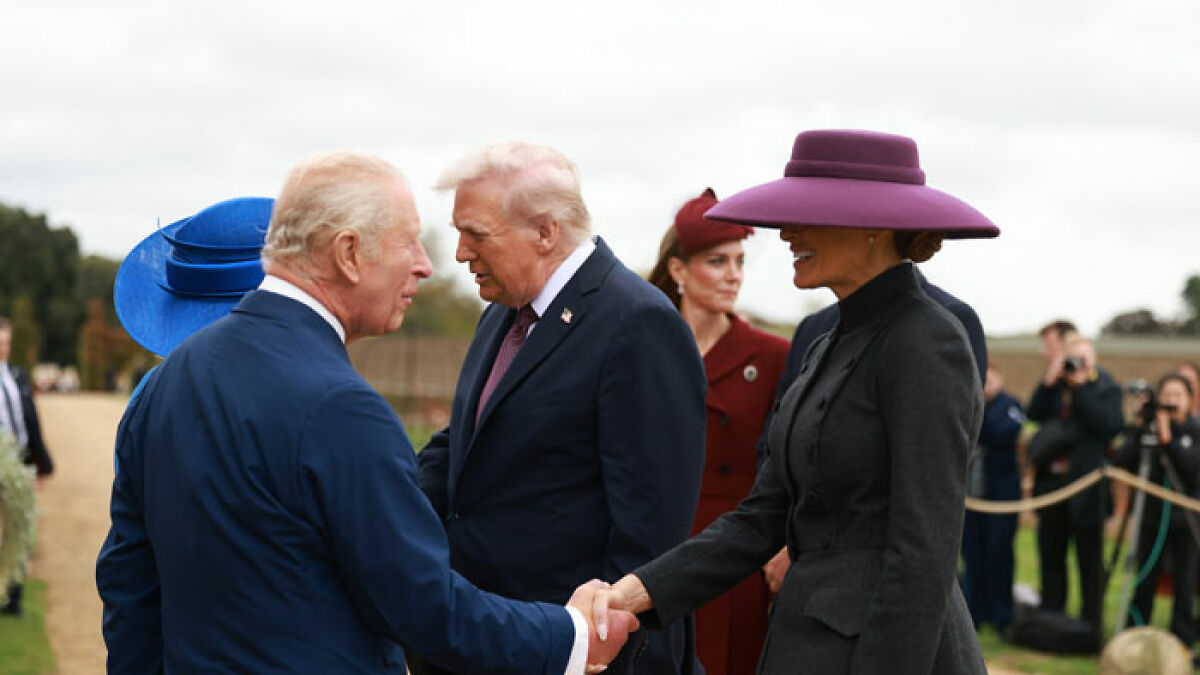 Melania Trump in a large purple hat shaking hands with British royals during state visit with Donald Trump outdoors.
