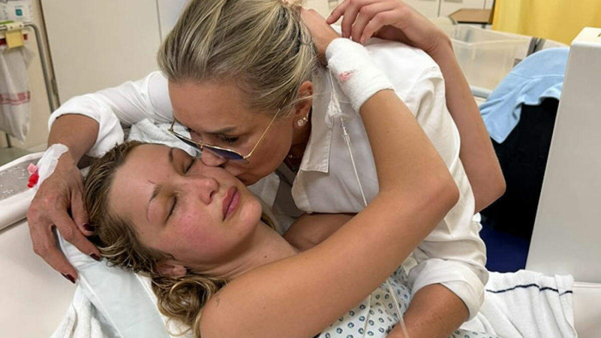 Yolanda Hadid embraces daughter Bella in hospital, sharing emotional message amid her darkness and pain.