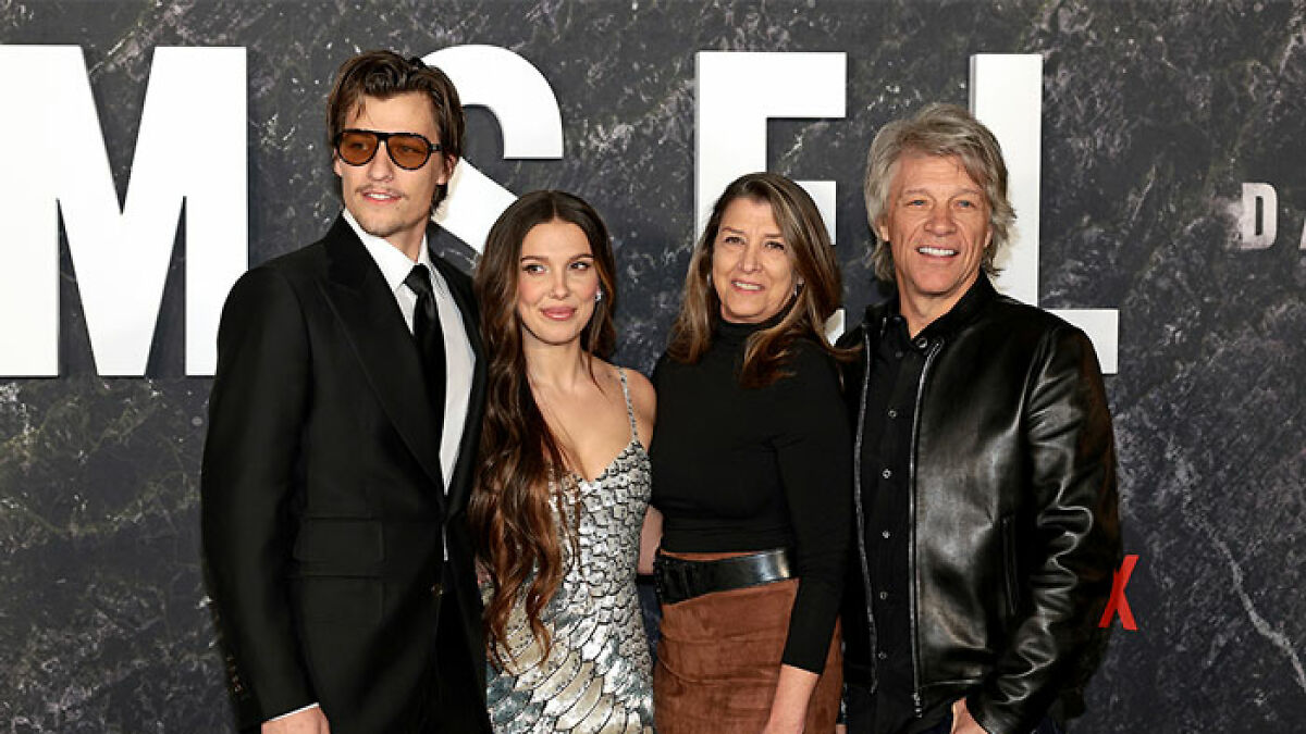 Jon Bon Jovi with family at event, highlighting his son Jake and Millie Bobby Brown's adoption decision discussion.