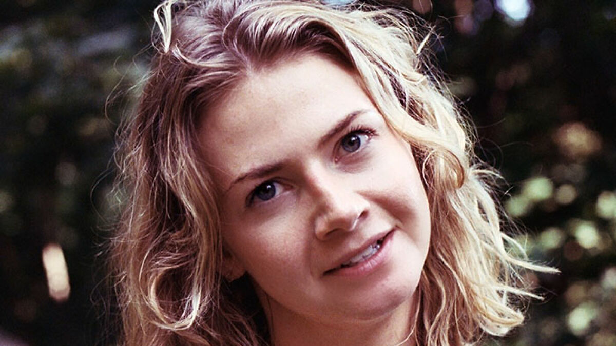 Young woman outdoors with blonde hair and blue eyes, related to Brooklyn midwife safety concerns for non-white women.