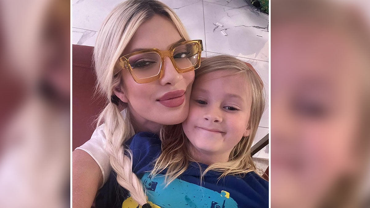 Blonde woman wearing oversized glasses hugging a young child closely, highlighting celebrity awful parenting moments.