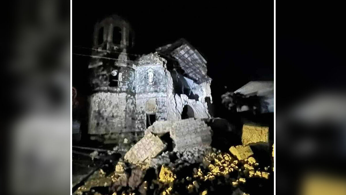 Damaged historic building rubble at night after massive 6.9 magnitude earthquake in the Philippines causing destruction.