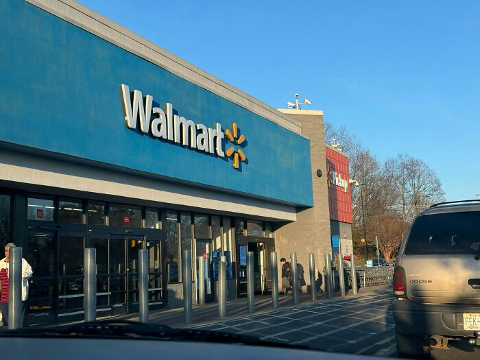 Exterior view of a Walmart store with cars parked outside, illustrating nasty things exes did that shocked partners.