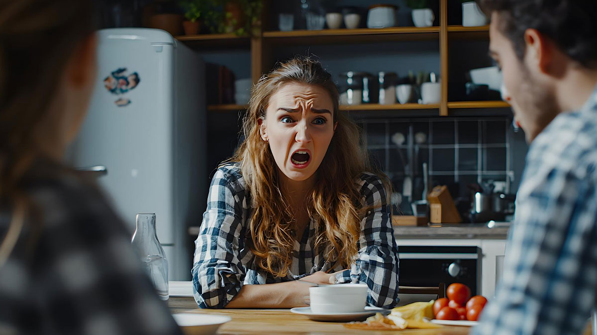 Eldest sister reveals promiscuous past while arguing angrily with youngest brother in a kitchen setting.