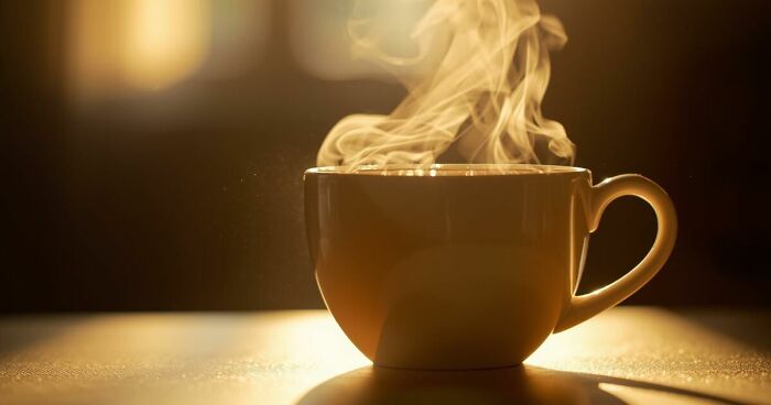 Steaming cup of coffee on table capturing small daily life moments that bring joy in a peaceful morning setting.