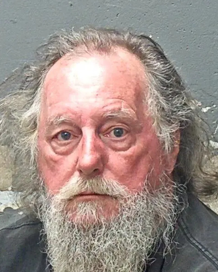 Mugshot of an older man with a long gray beard related to butt dial arrest in flight attendant mysterious disappearance case. Mugshot of an older man with a long gray beard related to butt dial arrest in flight attendant mysterious disappearance case.