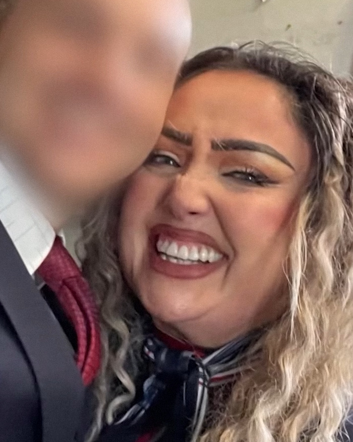 Flight attendant smiling with curly hair, close-up portrait related to butt dial arrest and mysterious disappearance. Flight attendant smiling with curly hair, close-up portrait related to butt dial arrest and mysterious disappearance.