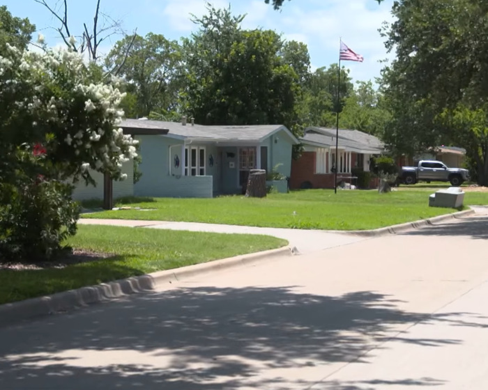 Suburban street with houses and trees where butt dial led to shocking arrest in flight attendant’s mysterious disappearance. Suburban street with houses and trees where butt dial led to shocking arrest in flight attendant’s mysterious disappearance.