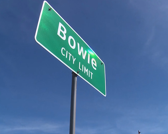 Bowie city limit sign against clear blue sky related to butt dial arrest in flight attendant disappearance case. Bowie city limit sign against clear blue sky related to butt dial arrest in flight attendant disappearance case.