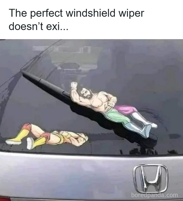 Car rear windshield wiper decorated with humorous men humor meme stickers of muscular wrestlers.