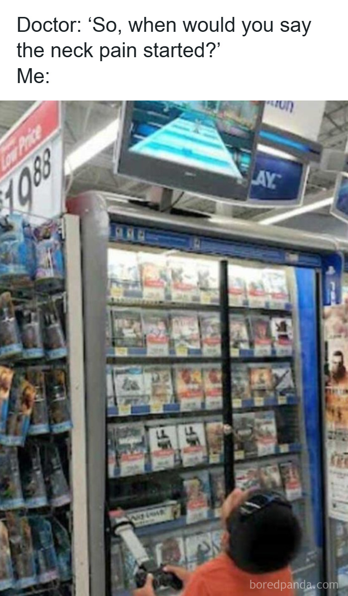 Man with neck pain playing video games in a store aisle, illustrating men humor coping with stress instead of therapy.