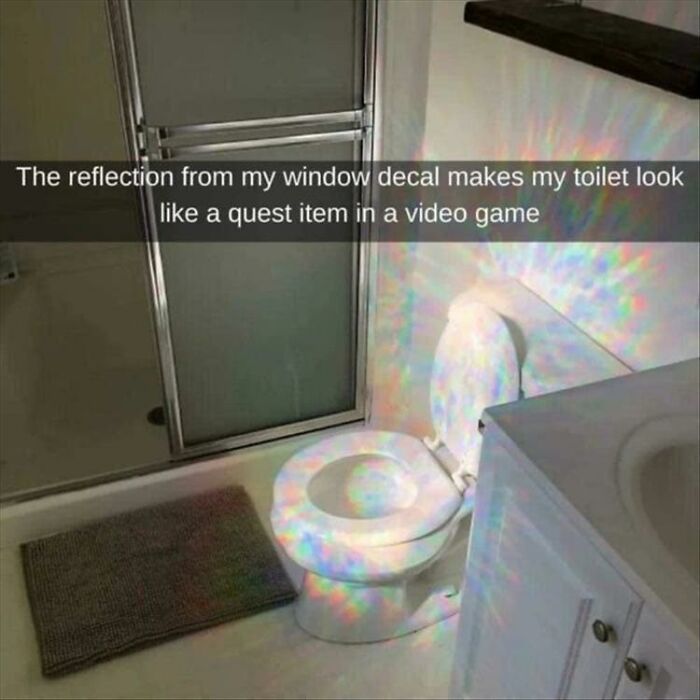 Toilet illuminated by colorful light reflection from window decal in a bathroom setting, showcasing men humor meme coping theme.