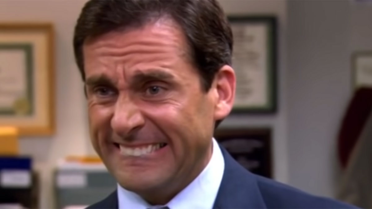 Man in office suit making a stressed face, illustrating millennial struggles at work meme concept.