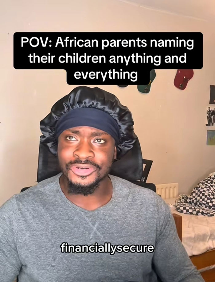 Man wearing a black bonnet and gray shirt discussing African names people canāt believe are real in a casual room setting. Man wearing a black bonnet and gray shirt discussing African names people canāt believe are real in a casual room setting.