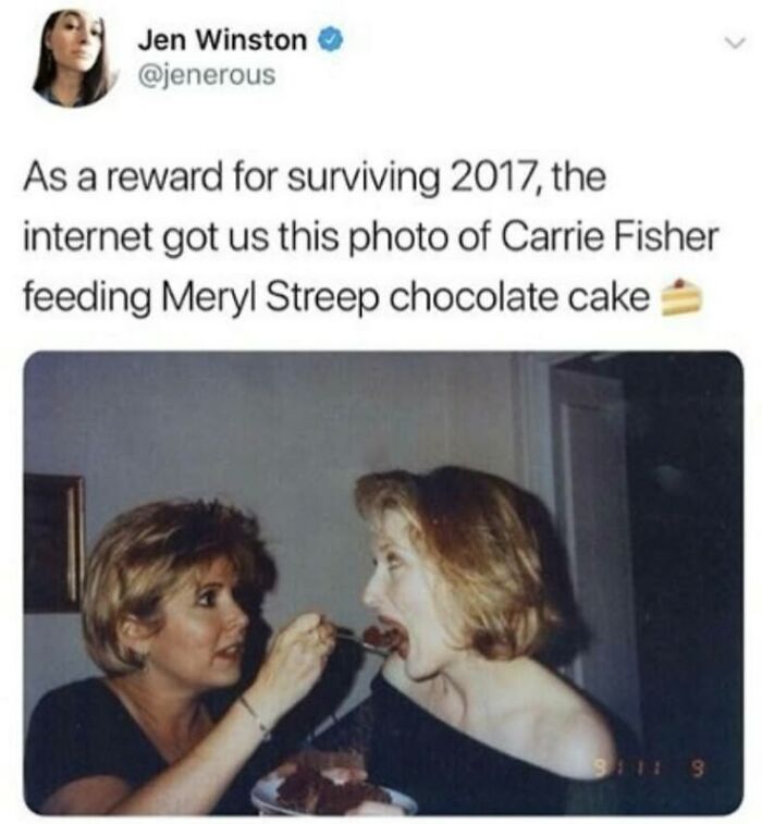 Tweet showing Carrie Fisher feeding Meryl Streep chocolate cake, a humorous moment from super culture memes to fight boredom.